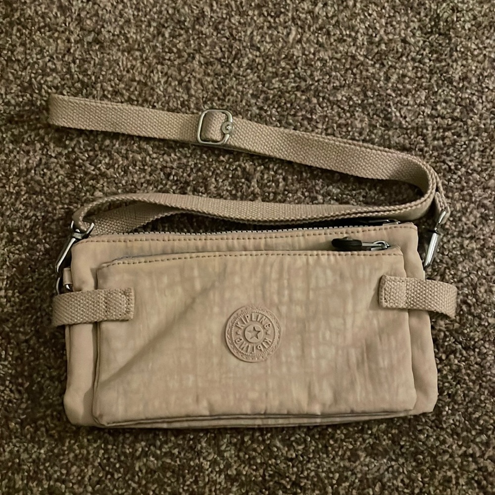Kipling Quaso small cross body clutch Peppery taupe tan color
